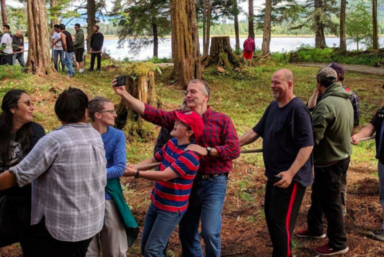 Best selfie of the month: Senator helping to raise totem pole