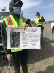 Ban Camp: Mayor shows up with cops, masks, signage