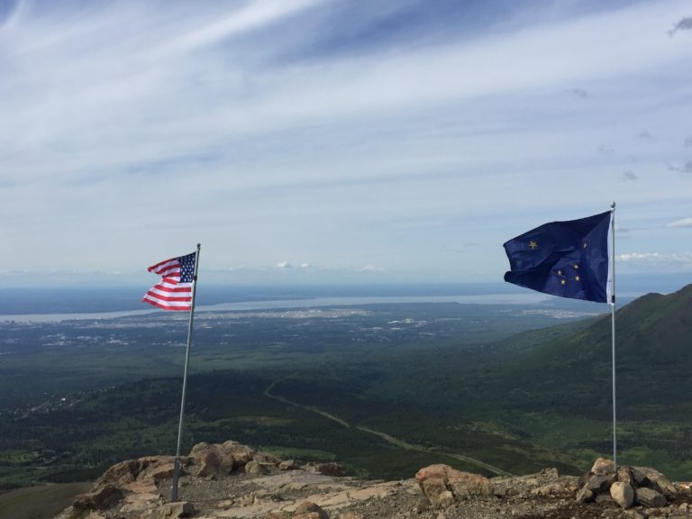 Old Glory joined by Alaska flag on Flattop Mountain