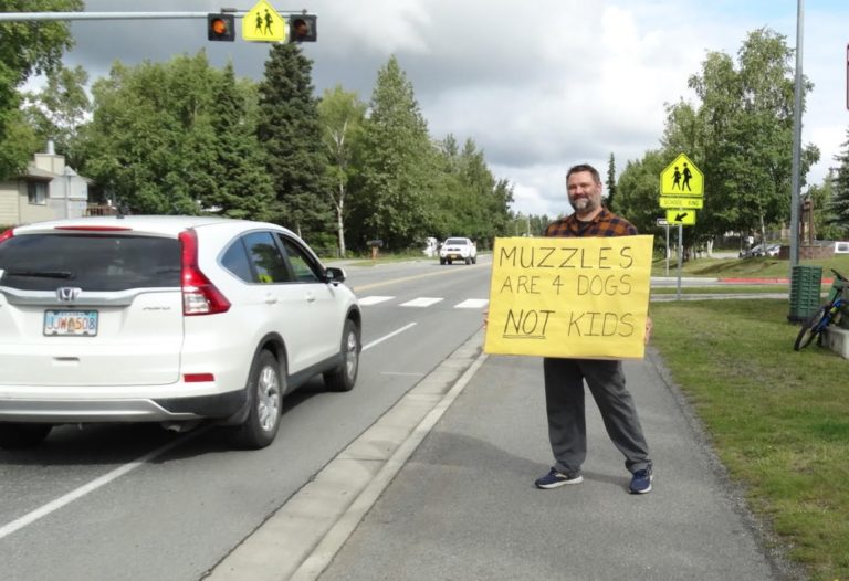 ‘Muzzle’ sign man accosted by ice cream truck driver, who grabbed his sign