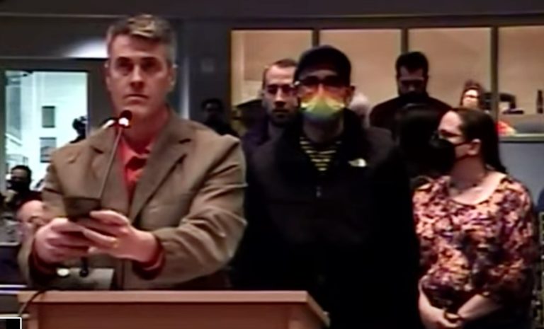 Gay man demands Bronson fire deputy librarian because she reminds him of his mother and other bad things