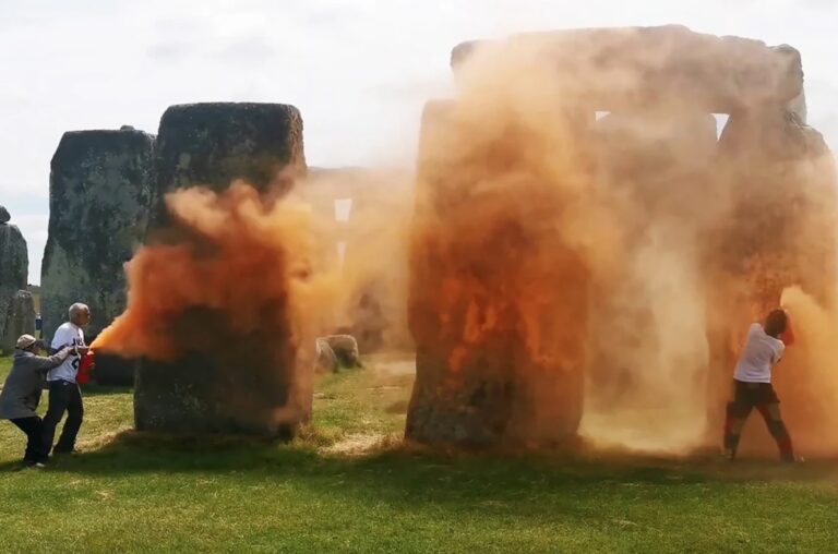 Climate activists paint Stonehenge orange