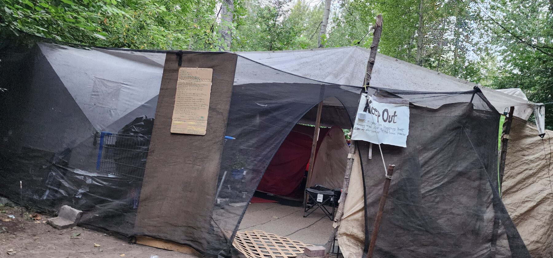 Photo tour of a vagrant TarpMart, where everything must go (because it’s probably stolen)
