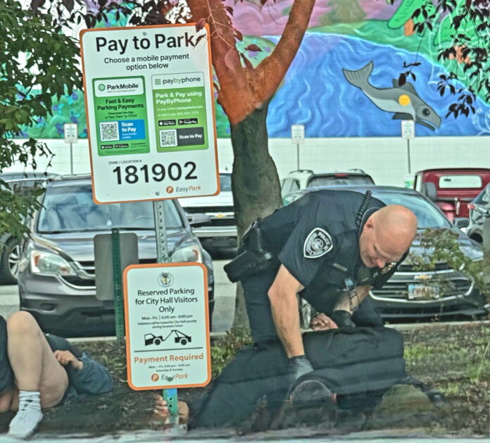 man arrested by city hall